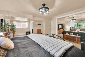 Carpeted bedroom featuring a baseboard radiator