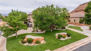 View of front facade featuring a front yard and stucco siding