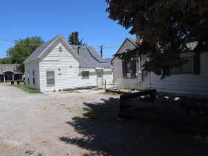 Looking north, west side view of main home and back of ADU in front
