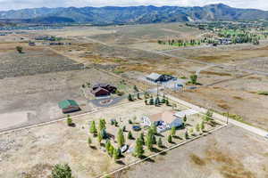 Aerial view of sparsely populated area featuring a mountain backdrop