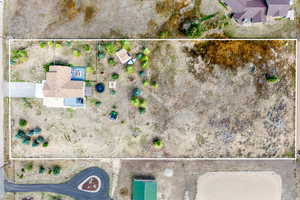 Aerial view of property and surrounding area with property parcel outlined