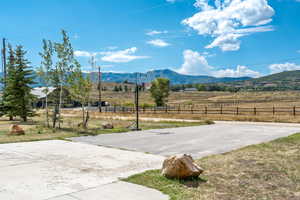 View of mountain backdrop with rural landscape
