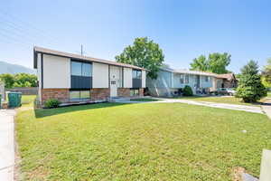 Raised ranch with brick siding
