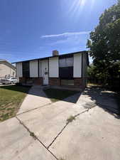 Bi-level home with brick siding