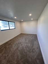 Empty room with recessed lighting, carpet, and baseboards