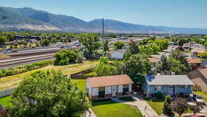 Aerial view of residential area featuring a mountainous background