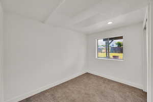 Spare room with carpet and recessed lighting