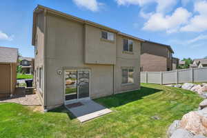 Rear view of house with stucco siding