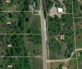 Aerial overview of property's location featuring property parcel outlined