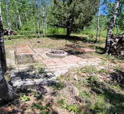 View of yard featuring an outdoor fire pit