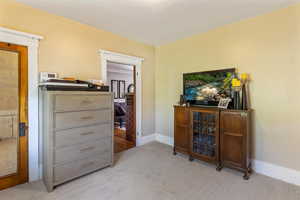 Bedroom with carpet and baseboards