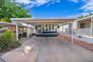 View of patio with a detached carport