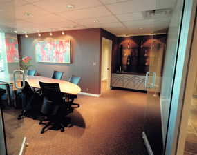 Office with carpet flooring, a paneled ceiling, baseboards, and rail lighting