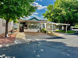 Manufactured / mobile home featuring covered porch