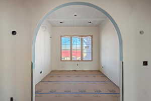 Spare room with arched walkways