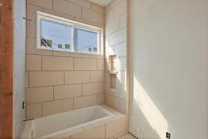 Full bath featuring a tub