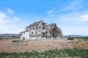 Rear view of house with a mountain view
