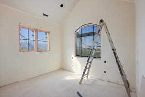 Unfurnished room featuring plenty of natural light