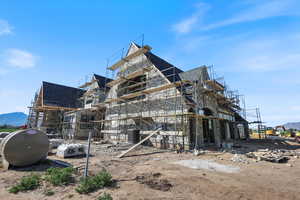 View of property exterior featuring roof with shingles and cooling unit