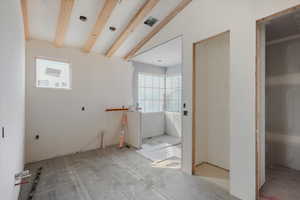 Bathroom featuring beam ceiling