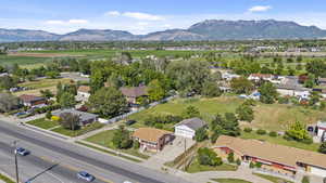 Aerial perspective of suburban area featuring a mountain backdrop