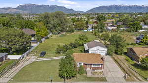 Aerial perspective of suburban area with a mountainous background