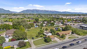 Aerial perspective of suburban area featuring a mountain backdrop