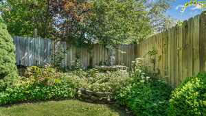 View of fenced backyard
