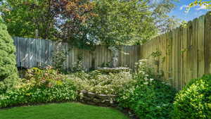 View of fenced backyard