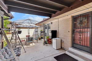 View of patio / terrace with outdoor dining space, a gazebo, and entry steps