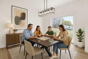 Dining space featuring light wood-type flooring and baseboards