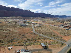 Aerial overview of property's location featuring a mountain backdrop