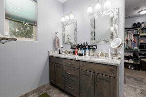 Full bath featuring double vanity