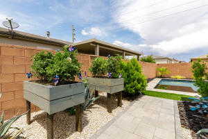 Fenced backyard featuring a patio