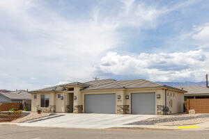 Prairie-style home with a garage and concrete driveway