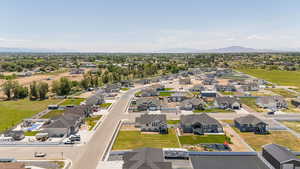 Aerial perspective of suburban area featuring a mountain backdrop