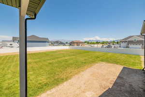 View of yard with a mountain view and a residential view