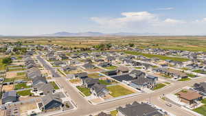 View of property location featuring a mountain backdrop and nearby suburban area