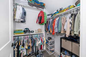 Spacious closet featuring carpet floors
