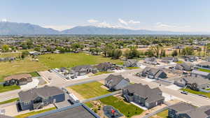 Aerial perspective of suburban area featuring a mountain backdrop