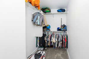 Spacious closet with carpet flooring