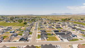 View of property location featuring a mountain backdrop and nearby suburban area
