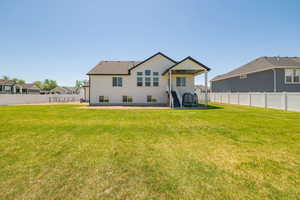 Rear view of property featuring stucco siding