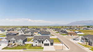 Aerial view of residential area featuring mountains