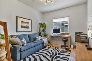 Office space featuring wood finished floors