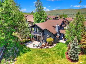 Aerial view of residential area featuring a mountainous background