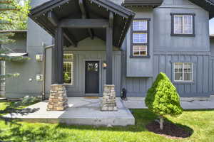 Property entrance with board and batten siding