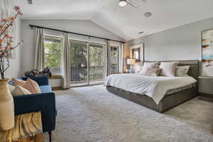 Bedroom featuring access to exterior, lofted ceiling, carpet floors, baseboards, and ceiling fan
