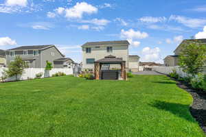 Rear view of house featuring a gazebo