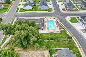 Aerial view of residential area featuring a community pool